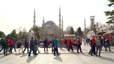 Istanbul, Turkey - March 05, 2020: Peoples walking on Sultanahmet square in front of the Blue Mosque. Istanbul, Turkey