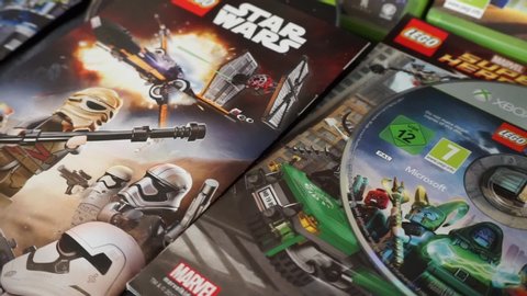 Rome, Italy - March, 21 2020, three Lego games for Xbox 360: Jurassic World, Star Wars (The awakening of the force) and Marvel Super Heroes.