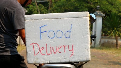 Delivering  food by  motorcycle , outdoor  Chiangmai Thailand