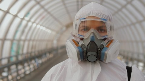 Portrait virologist medical worker in protective suit, goggles and respirator. Covid-19 coronavirus global epidemic spreading prevention, USA, Italy, Europe