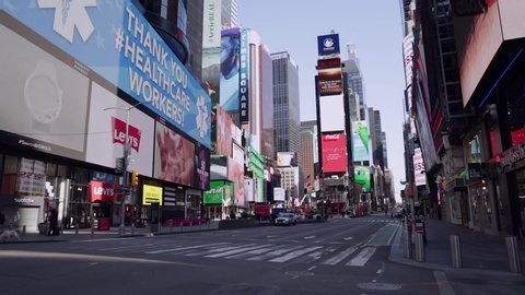 New York. March 27 2020. Virtually Empty Times Square and Midtown streets due to Coronavirus COVID-19 outbreak and Stay at Home regulation issued by Governor Cuomo