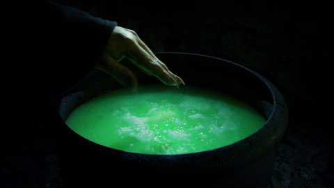 Witch Making Bubbling Potion In Cauldron