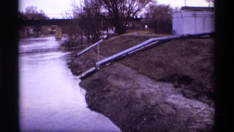 ROCKFORD MINNESOTA-1969: Water Being Diverted Into Flowing River As It Passes Under Bridge