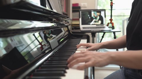 Online learning piano lessons, Online training or E-learning scene of instructor broadcasting class to network, vlog or teacher make online piano lesson to teach students pupils learn from home.