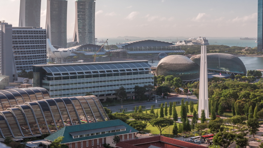 A beautiful morning panorama with Marina Bay area and skyscrapers city skyline aerial timelapse. The tower shape building at the North bridge road in Singapore.