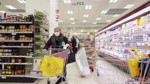 Crowd of People choosing and buying to stockpile products at Supermarket Store after Italian government announce to shut down country about Coronavirus or COVID-19 pandemic Verona – Italy 26/03/2020
