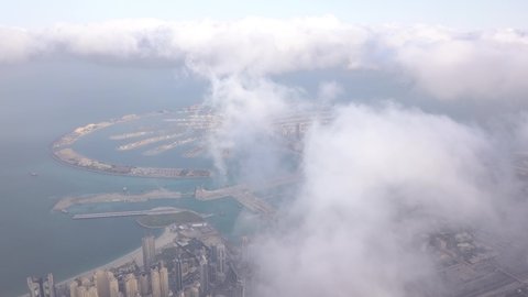 Palm Jumeirah, Dubai Marina in clouds. View from the drone