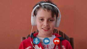 Child in videochat with headphones