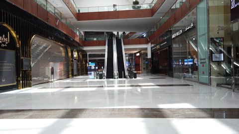 DUBAI, UAE - MARCH, 2020: Empty and abandoned shops inside the largest shopping mall in the world because of coronavirus, The Dubai Mall.