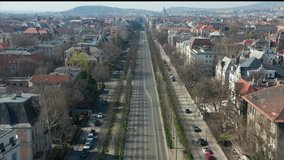 Empty tourist destination in Budapest, Hungary. People stay at home in self quarantine curfew, during the COVID-19 coronavirus. 
Pest, Andrassy Avenue in abandoned view. - Powered by Shutterstock - Get 15% off with code: PIKWIZARD15