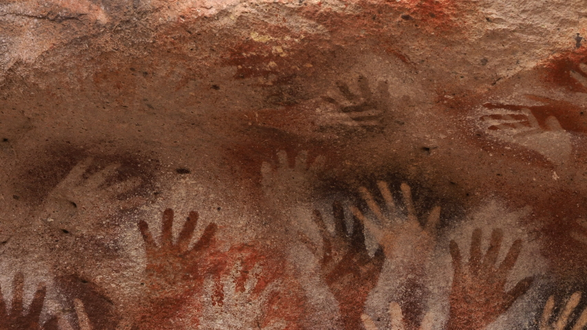 Prehistoric hand paintings at the Cave of Hands (Spanish: Cueva de Las Manos ) in Santa Cruz Province, Patagonia, Argentina. The art in the cave dates from 13,000 to 9,000 years ago. Royalty-Free Stock Footage #1049307061