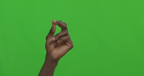 Black man snapping his fingers over green chroma key background. 4k