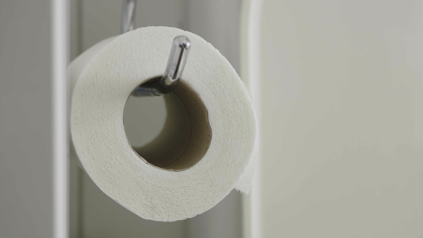 Man Takes Piece of Toilet Paper Royalty-Free Stock Footage #1049317003