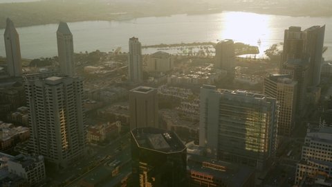 Aerial helicopter footage of the downtown San Diego skyline during a beautiful sunset. California, USA.