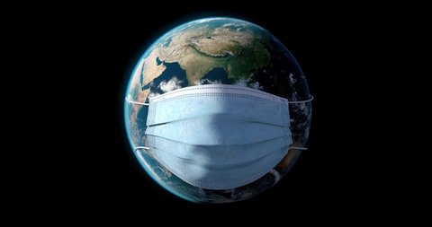 World Pandemic Danger. Realistic Planet Earth with a Surgery Face Mask on Black Background. World Coronavirus Pandemic. The world in quarantine. 