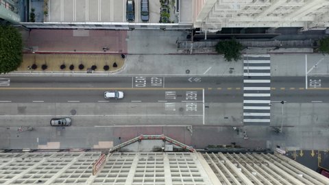 Birdseye flight in Los Angeles over Broadway street the streets are empty because of the pandemic