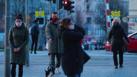 Social adaptation people to viral infections COVID 19 in Europe. People wear medical masks on their faces. Keeping a personal distance. Cz, Prague, Hradcanska, 27.3.2020. 
