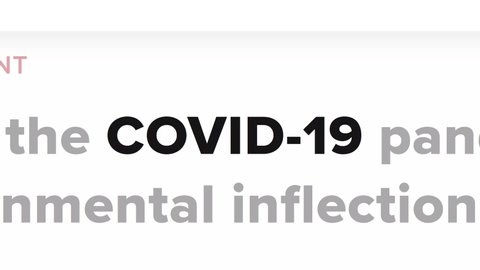 Cluj-Napoca, Romania - March 30, 2020: Zoom out - COVID-19 in the news titles across international media. Coronavirus, COVID-19 concept. Coronavirus, COVID-19 illustrative editorial. SARS-CoV-2 animation