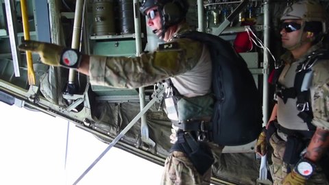 CIRCA 2019 - 308th Rescue Squadron pararescuemen perform a military freefall from the back of an aircraft at Patrick Air Force Base.