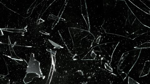 Super Slow Motion Shot of Real Glass Break at 1000 fps Isolated on Black Background.