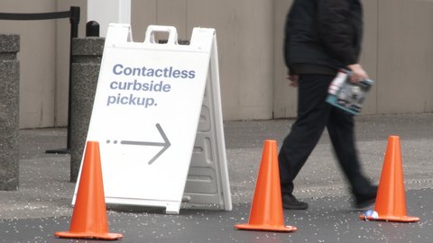 PORTLAND, OREGON / USA - MARCH 2020: Shoppers take advantage of store offering contactless curbside pickup during stay at home lockdown and to avoid the corona virus.