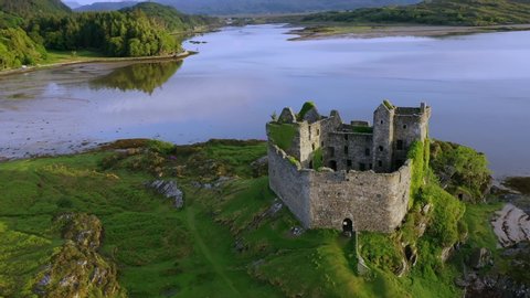 A drone shot of Castle Tioram a ruined castle that sits on the tidal island Eilean, Tioram in Loch, Moidart, Lochaber, Highland, Scotland