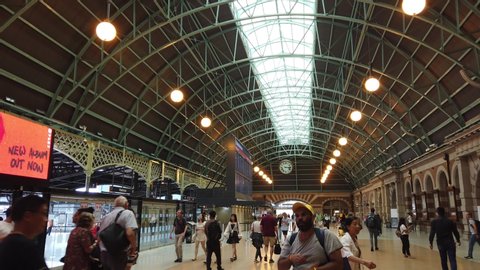 SYDNEY, NSW, Australia - Feb 16 2020: Interior passenger Grand Concourse of Sydney Central Station. people travel on railroad. transport information center which is showing timetable on the big screen
