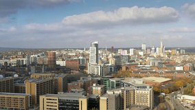 Aerial drone video, pull back reveal shot, of Leeds City Centre, West Yorkshire, UK