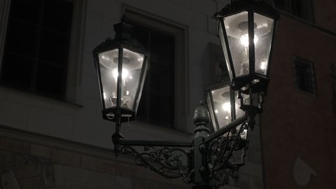 Vintage street lamp in night. A view of modern burning street lamp in the road in night.