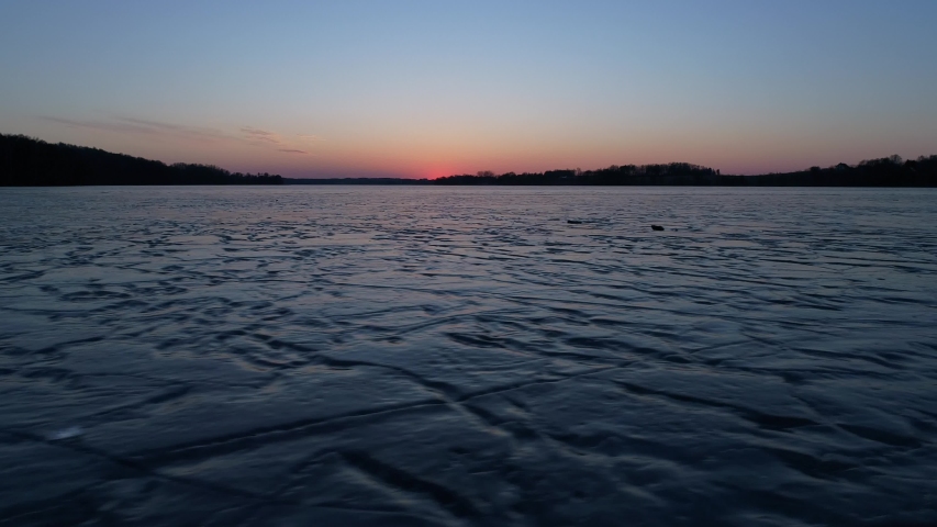 beautiful sunset over the frozen lake
