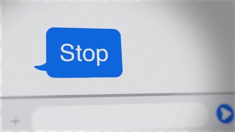 Stop - text message in chat on computer or phone screen - close up