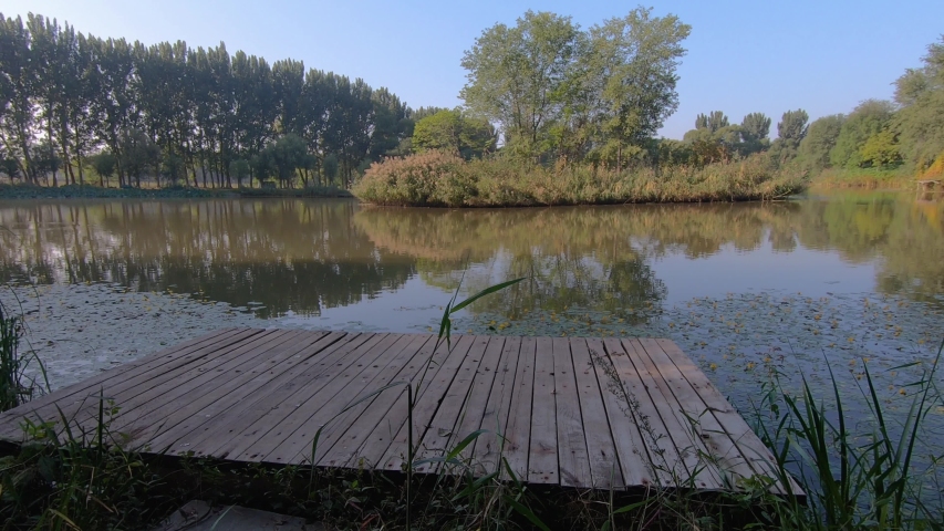 Man Sits And Enjoys Beautiful View Of Lagoon At Hanshiqiao Wetlands, Beijing, China