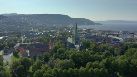 Panorama of Nidaros cathedral with Trondheim suburbs in background, aerial