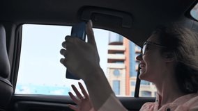 The girl is broadcasting live from a car using a phone from Dubai.