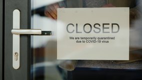 Business owner hangs on door announcement of closure due to coronavirus quarantine. - Powered by Shutterstock - Get 15% off with code: PIKWIZARD15