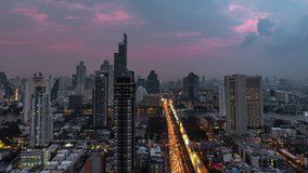 Sunrise Time lapse High angle aerial view of Metropolis building and traffic on highway bridge crossing the river with driving cars on city street and illuminated street lights at downtown district - Powered by Shutterstock - Get 15% off with code: PIKWIZARD15