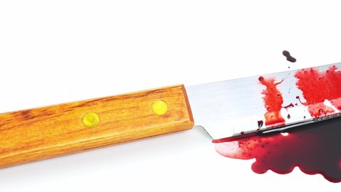 Move the camera angle from left to right, Blood knives are spread over on a white background.