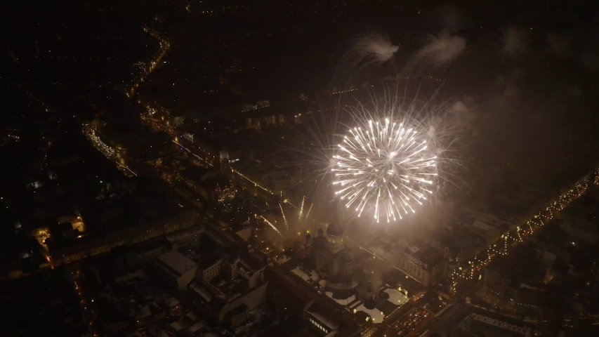Aerial night shot of spectacular parade fireworks over an European city. Cluj, Romania Royalty-Free Stock Footage #1049501887