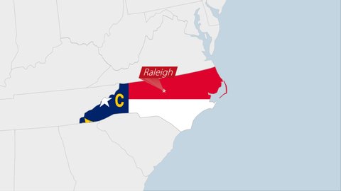 US State North Carolina map highlighted in North Carolina flag colors and pin of country capital Raleigh, map with neighboring States.