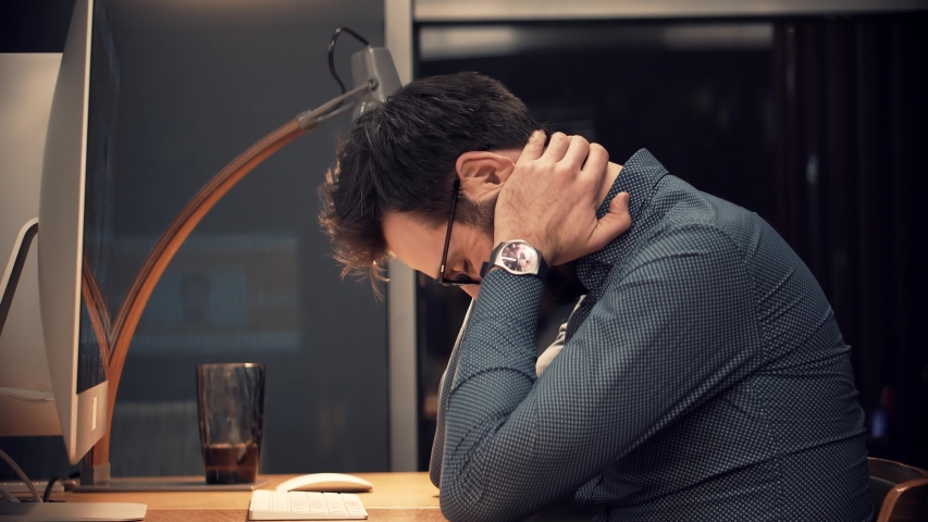 Tired Worker Overworked On Computer.Frustrated Businessman Working Alone.Office Work Overtime. Workaholic Work In Internet Deadline.Tired Businessman In Night Office.Overwhelmed Exhausted Stressed Man | Shutterstock HD Video #1049512876