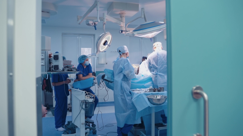 Team surgeon at work in operating room. Modern equipment in operating room. Medical devices for neurosurgery. Royalty-Free Stock Footage #1049514277