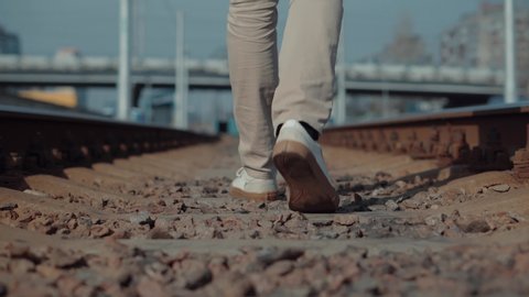Lonely Businessman Feet In Pants Walking On Rail Road When Train Or Tram Cancelled. Man Walks To Home On Railroad Tracks After Canceled Public Transport .Tourist Legs Walking On Railway Middle Of Rail