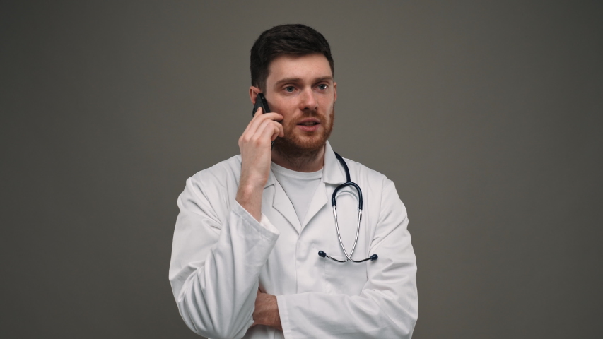 Male Doctor Talking with Pacient on Phone. Doctor Using Phone. Helath Care, Corona Virus Concept