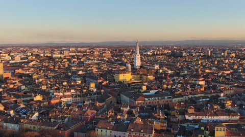 modena city centre aerial view drone fly orbit over downtown at sunset 4k
