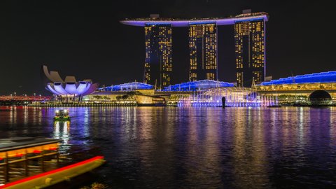 Singapore, Singapore-May 20, 2019: Marina Bay Sands in Singapore at the night. 8K resolution. Timelapse. Spectra Light and Water Show Marina Bay Sand Singapore