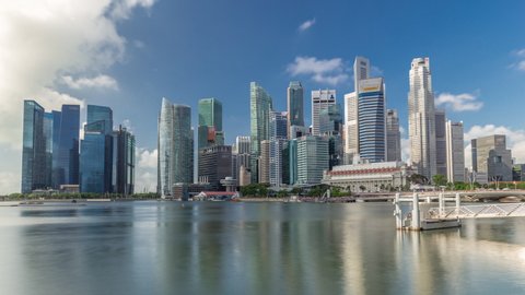 Business Financial Downtown City and Skyscrapers Tower Building at Marina Bay timelapse hyperlapse, Singapore, Cityscape Urban Landmark and Business Finance District Center reflected in water
