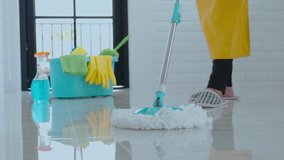 Young asian woman cleaning house Sweeping the floor with a mop House keeping concept