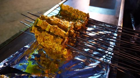 barbecue Paneer Tikka Kabab - Indian Tandoori cottage cheese cubes in red and white sauce in sticks