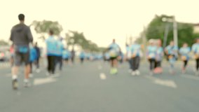 Slow motion video clips of many marathon athletes on the road in the morning. The concept of exercise to maintain good physical health.