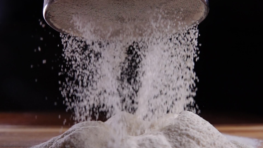 Making cake batter, sifting flour to make it more airy. Super slow motion | Shutterstock HD Video #1049595376
